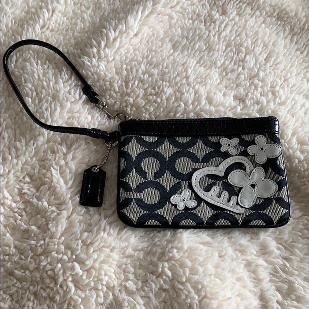 Black and grey Coach wristlet